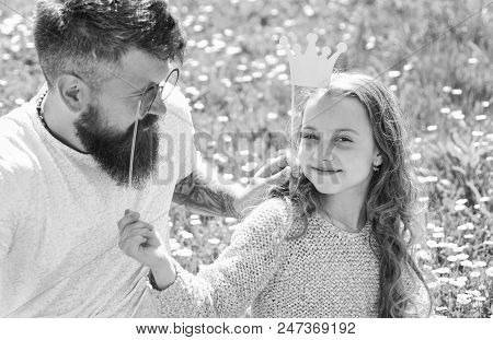 Best Friends Concept. Dad And Daughter Sits On Grass At Grassplot, Green Background. Family Spend Le