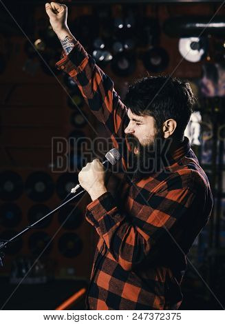 Musician With Beard And Mustache Singing Song In Karaoke. Hipster Likes To Sing On Stage. Man With E
