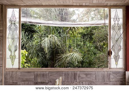 Window With Palm View In A Cafe Ubud
