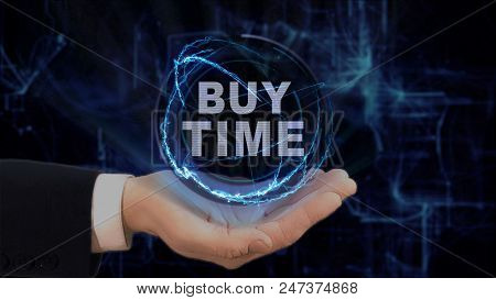 Painted Hand Shows Concept Hologram Buy Time On His Hand. Drawn Man In Business Suit With Future Tec