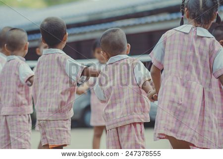 Young Kids Exercise With Hoola Hoop In The Morning.