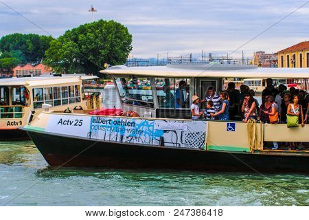 Venice, Italy - June, 28: Regular-route swimming bus on a channel in Venice, Italy