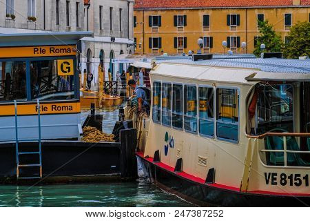 Venice, Italy - June, 28: Regular-route swimming bus on a channel in Venice, Italy