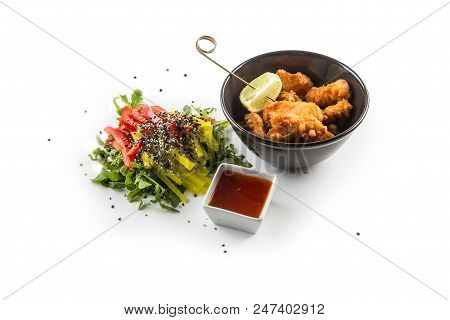 Fried Samon Pieces With Sauce And Vegetable Salad Isolated On White Background.