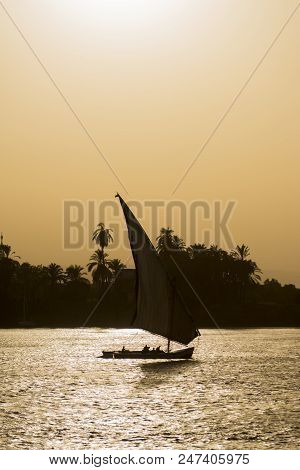 Traditional Felluca Sailing Boat Silhouette At Sunset