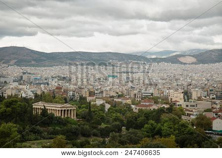 View of Athens in Greece and the mountains with the Hephaistos temple in foreground