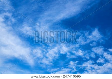 Beautiful Blue Sky With Fleecy Clouds. Abstract Background.