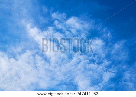 Beautiful Blue Sky With Fleecy Clouds. Abstract Background.