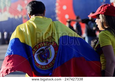 ST. PETERSBURG, RUSSIA - JUNE 28, 2018: Colombian football fans at FIFA Fan Fest in Saint Petersburg during the FIFA World Cup 2018 match Colombia vs Senegal. Colombia won 1-0