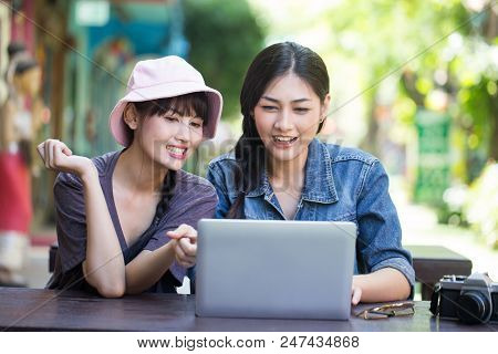 Portrait Of Happy Traveler Woman In City. Asian Women Using Laptop For Seach Location, People With T