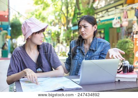 Portrait Of Traveler Woman In City. Asian Women Using Map And Laptop For Seach Location, People With