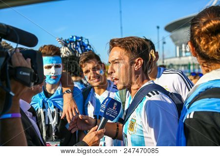 St. Petersburg, Russia - June 26, 2018: Journalist Interviewing Sport Fans Of Argentina National Foo