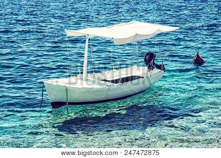 Anchored Little Boat In Maslinica, Solta Island, Croatia. Summer Vacation Destination. Bue Photo Fil
