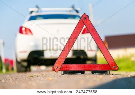 A Car With A Breakdown Alongside The Road. Warning Triangle