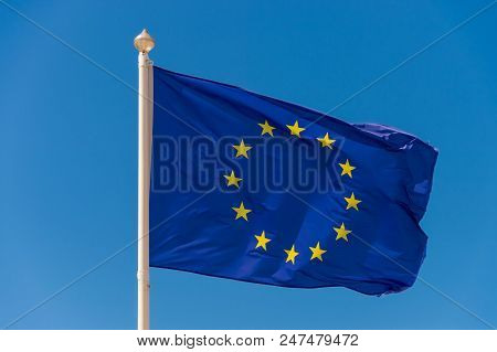 European Flag Waving Against Blue Sky In Wimereux, France.