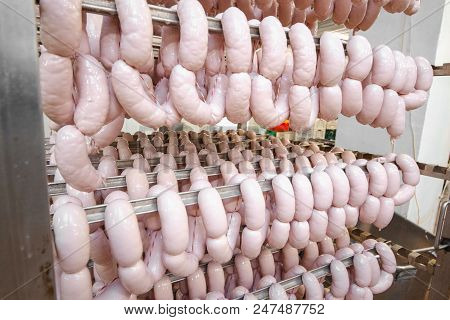 Sausage. Sausage Production Line. Sausage On The Counter For The Smokehouse. Industrial Manufacture