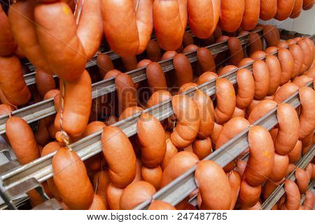 Sausage. Sausage Production Line. Sausage On The Counter For The Smokehouse. Industrial Manufacture
