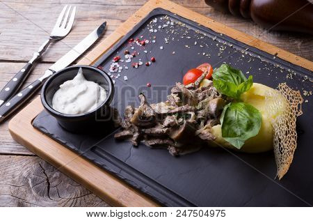 Beef Stroganoff Served With Mashed Potato On A Board