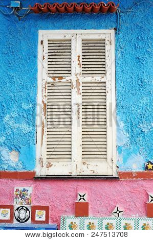 Vietri Sul Mare, Italy - April 27, 2018 Ancient Window Of Colored House, With Traditional Ceramics D