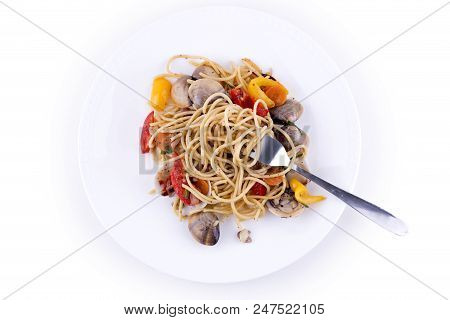 Seafood Spagheti At The Plate Over The White Background