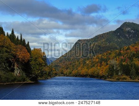 This River In The Middle Of The Jaques Cartier National Parc Is The One Who Draw This Beautiful Scen