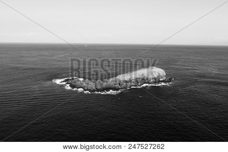 Aerial view of small island. View from Bukit Asah, new tourist attraction of tropical island Bali, Indonesia - black and white photo