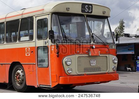 Mariefred, Sweden - August 7, 2016: Old Timer Volvo Public Transportation Bus In Orange Color As It 