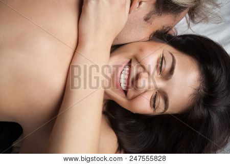 Young Husband Hugging And Kissing Beautiful Wife Enjoying Romantic Sensual Moment Together, Having P