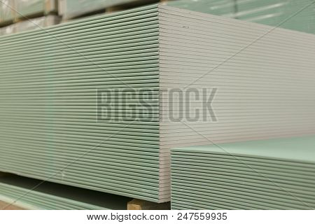 Pallet With Plasterboard In The Building Store. Warehouse With Plasterboard. Sheets Of Plasterboard 