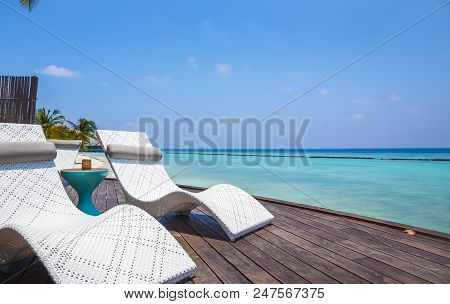Deckchair And Beautiful Turquoise Indian Ocean In Maldives