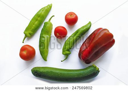 Mix Of Vegetables On White Back Ground. Tomatoes, Green Pepper, Red Pepper, Cucumber And Zucchini. F
