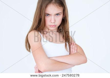 Emotion Face. Child Making A Hurt Look. Offended Capricious Kid. Little Girl Portrait On White Backg