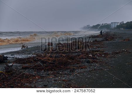 Big Waves Throw Garbage And Twigs Ashore Pebble Beach Stormy Weather