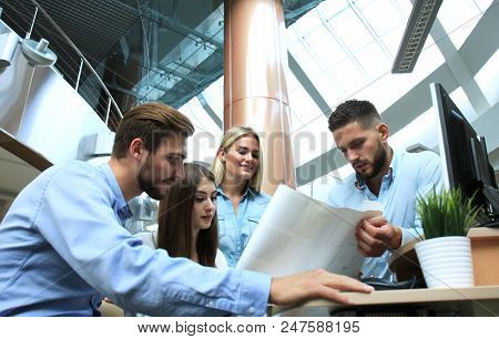 Group Of Young Modern People In Smart Casual Wear Having A Brainstorm Meeting While Standing In The 