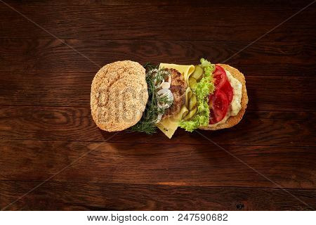 Flat Lay Of Delicious Fresh Home Made Burger With Piccoli, Lettuce, Cheese, Onion, Tomato, Dill And 