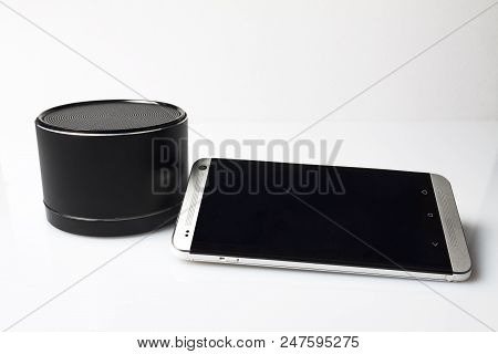 The Phone With A Portable Calorimeter On A White Background Is Not Insulated.