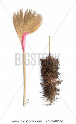 Brown Grass Broom And Feather Duster Isolated On White Background