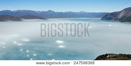Mist Over Glacier In A Sunny Day Near Narsarsuaq