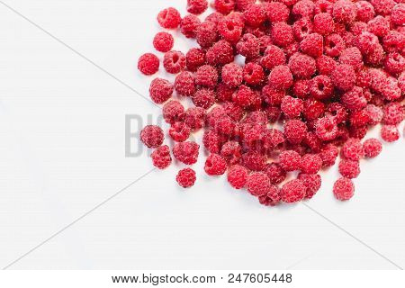 Dripping Raspberry On White Background. Close-up Photo.
