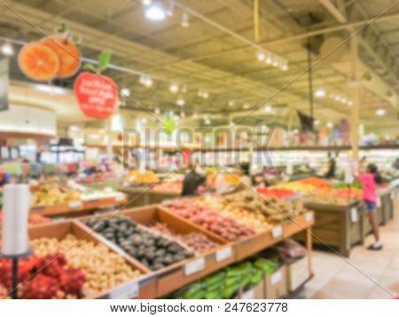 Abstract Blurred Busy Customer Shopping For Fresh Vegetables In Grocery Store