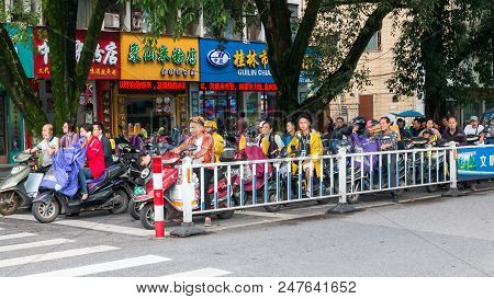 Guilin, China - May 10, 2018: Scene Asian Street With Motorbikes And Mopeds At Stop Near Crosswalk I