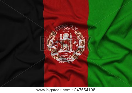 Afghanistan Flag Is Depicted On A Sports Cloth Fabric With Many Folds. Sport Team Waving Banner