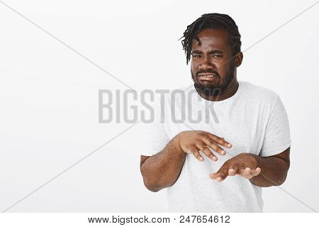 When You Touch Food In Sink. Portrait Of Disgusted Funny Dark-skinned Guy In White T-shirt, Shaking 
