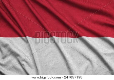 Indonesia Flag  Is Depicted On A Sports Cloth Fabric With Many Folds. Sport Team Waving Banner