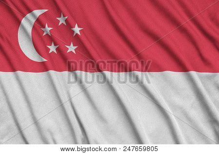 Singapore Flag  Is Depicted On A Sports Cloth Fabric With Many Folds. Sport Team Waving Banner
