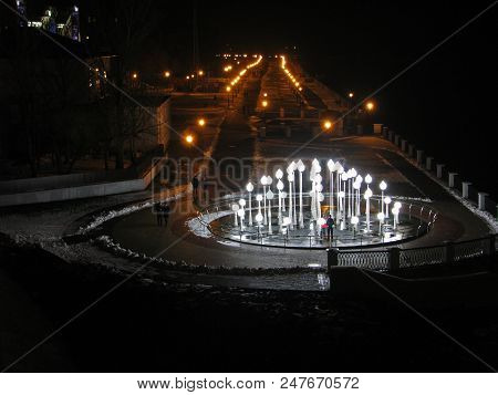 Seafront Street With Lighted Fountain At Night In Homel, Belarus.