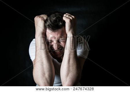 Portrait Of A Young Evil Person On A Black Background, Problems In The Family, Conflation At Work, N