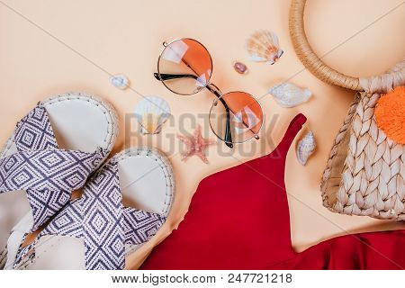 Summer Fashion Flatlay With Gradient Round Sunglasses, Straw Bag With Pompoms And Red Swimsuit With 