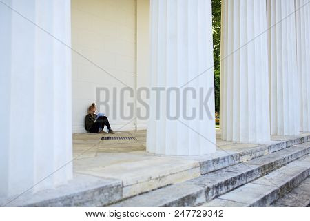 Vienna, Austria - May, 22: Nice Girl Reading A Book Next To The Columns Of The Theseus Temple On May