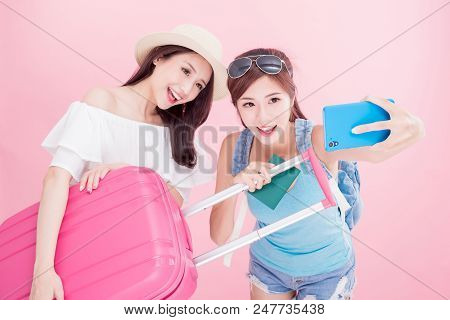Two Travel Woman Selfie Happily With Travel Concept On The Pink Background